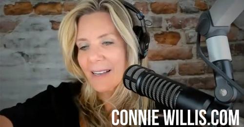 Connie Willis at a radio microphone — Coast to Coast AM host